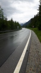 damp austrian road with mountains.jpg